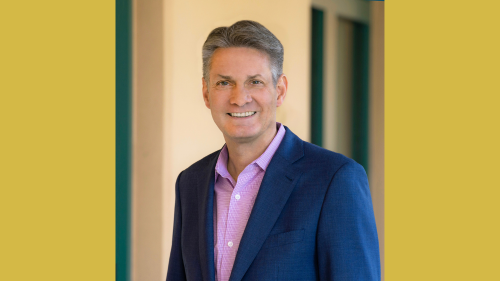 Headshot of Alan Berube on yellow background